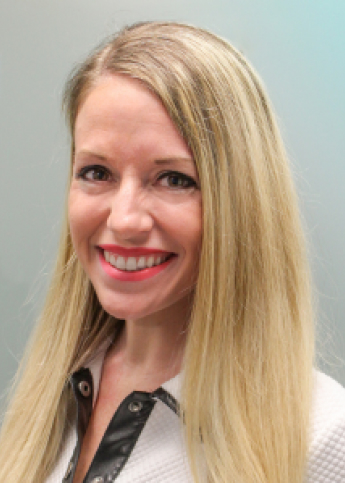 The image displays a professional headshot of a woman with long, straight blonde hair and a bright smile. She is wearing a white outfit with a black leather collar, suggesting a stylish and modern professional look.